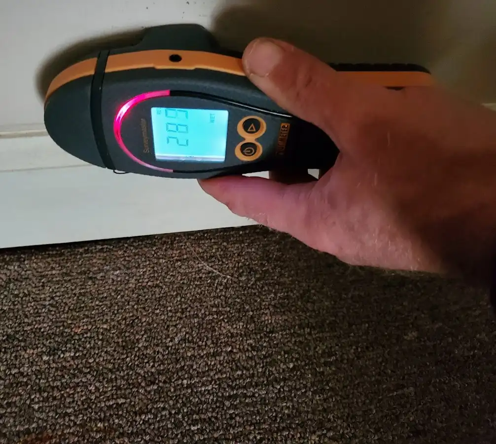Moisture detection at baseboard during Storm Damage Restoration in Lake Elsinore